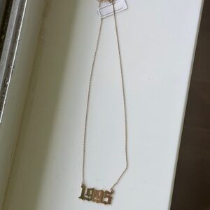 BRAND NEW gold plated 1995 necklace